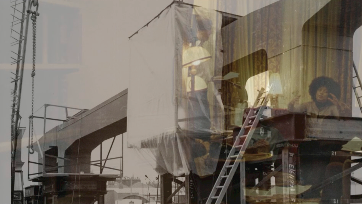 Mono and sepia image showing, from left, crane and construction on the Westway elevated road and right, people seated at a meeting of the Mangrove 9