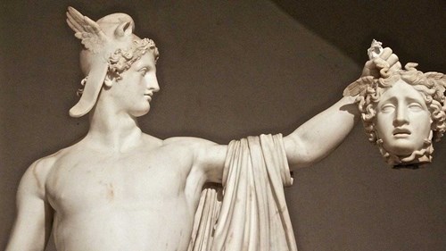 Greek classical marble statue of Perseus holding the head of Medusa.